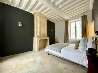 Un ou plusieurs lits dans un hébergement de l'établissement BAYA HOUSE - Histoire et Confort