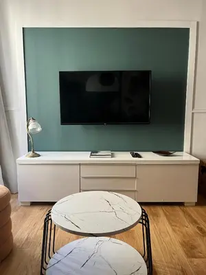 Télévision ou salle de divertissement dans l'établissement Le 7
