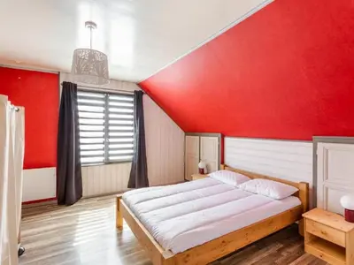 Un ou plusieurs lits dans un hébergement de l'établissement Holiday Home La Perle by Interhome