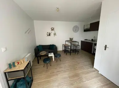Coin salon dans l'établissement Port de Caen Appartement