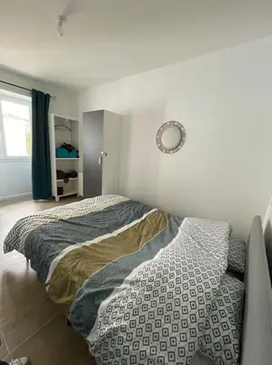 Un ou plusieurs lits dans un hébergement de l'établissement Port de Caen Appartement