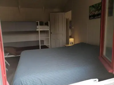 Un ou plusieurs lits dans un hébergement de l'établissement Cottage les petites voiles plage