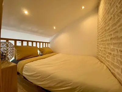 Un ou plusieurs lits dans un hébergement de l'établissement Bel appartement à deux minutes de la plage