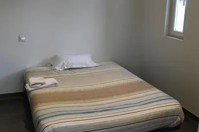 Un ou plusieurs lits dans un hébergement de l'établissement Hôtel et Restaurant de la Gare Torigny-les-Villes