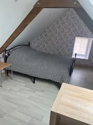 Un ou plusieurs lits dans un hébergement de l'établissement Maison chaleureuse parking privé proche de la mer