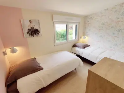 Un ou plusieurs lits dans un hébergement de l'établissement Maison 50m2 - 2 chambres - Jardin