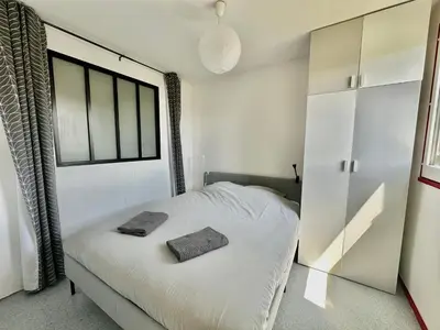Un ou plusieurs lits dans un hébergement de l'établissement Capucine, duplex à 5 min plage