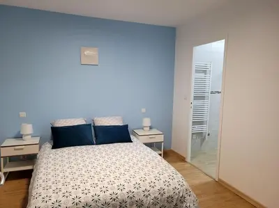 Un ou plusieurs lits dans un hébergement de l'établissement Le gîte du Bonheur