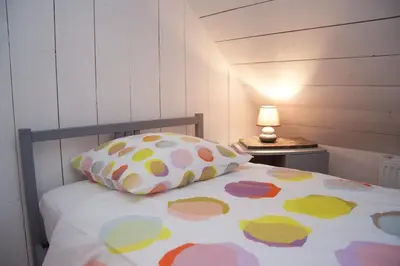 Un ou plusieurs lits dans un hébergement de l'établissement Maison Bel'Air Bayeux