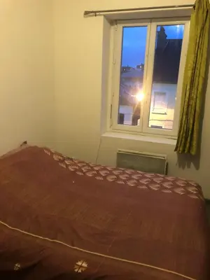 Un ou plusieurs lits dans un hébergement de l'établissement Petit appartement centre ville Granville