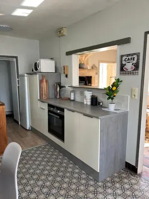 Cuisine ou kitchenette dans l'établissement Maison de vacances vaux sur seulles