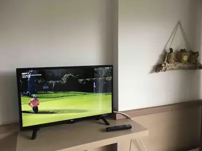 Télévision ou salle de divertissement dans l'établissement Studio Golf piscine D Day
