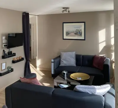Coin salon dans l'établissement Appartement Les Corsaires