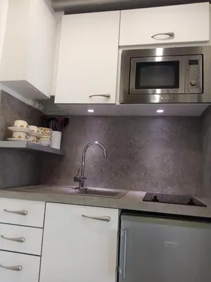 Cuisine ou kitchenette dans l'établissement LE PETIT CABOURG de LA COUR NORMANDE studio coeur de ville -1 à 2 personnes