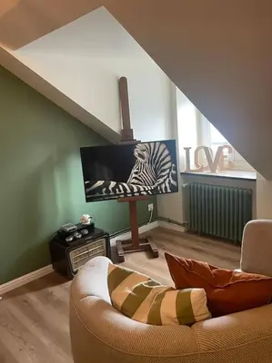 Télévision ou salle de divertissement dans l'établissement Appartement Cosy et charmant