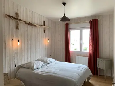 Un ou plusieurs lits dans un hébergement de l'établissement Charmante Maison de Campagne en Pierres et Bois