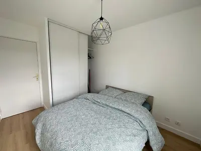 Un ou plusieurs lits dans un hébergement de l'établissement Appartement Caen