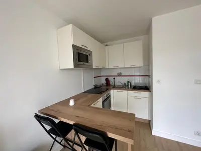 Cuisine ou kitchenette dans l'établissement Appartement Caen