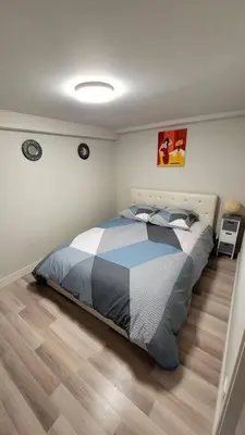 Un ou plusieurs lits dans un hébergement de l'établissement Appart 2 chambres avec extérieur