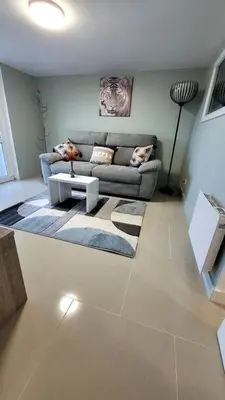 Coin salon dans l'établissement Appart 2 chambres avec extérieur