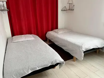 Un ou plusieurs lits dans un hébergement de l'établissement L'Ostréa, maison avec jardin à 200m de la mer-wifi