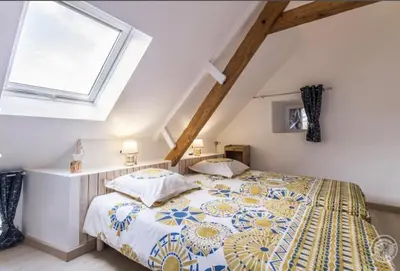 Un ou plusieurs lits dans un hébergement de l'établissement Gîte « Les Embruns »