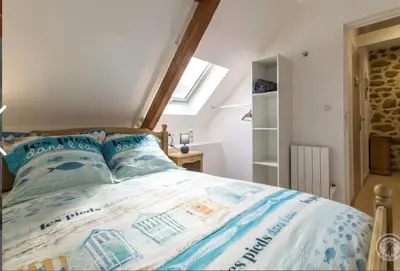 Un ou plusieurs lits dans un hébergement de l'établissement Gîte « Les Embruns »