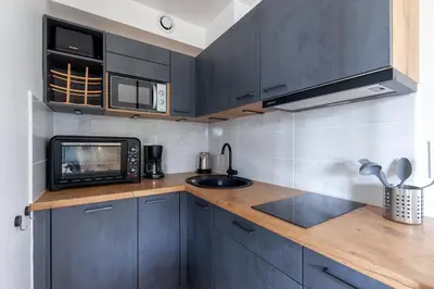 Cuisine ou kitchenette dans l'établissement Eole - Vue mer, à 200 m de la plage