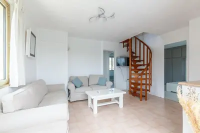 Coin salon dans l'établissement La maison des dunes - Proche plage pour 6