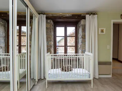 Un ou plusieurs lits dans un hébergement de l'établissement Holiday Home Les Grands Près by Interhome