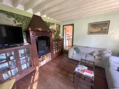 Télévision ou salle de divertissement dans l'établissement Le Vaussourdet